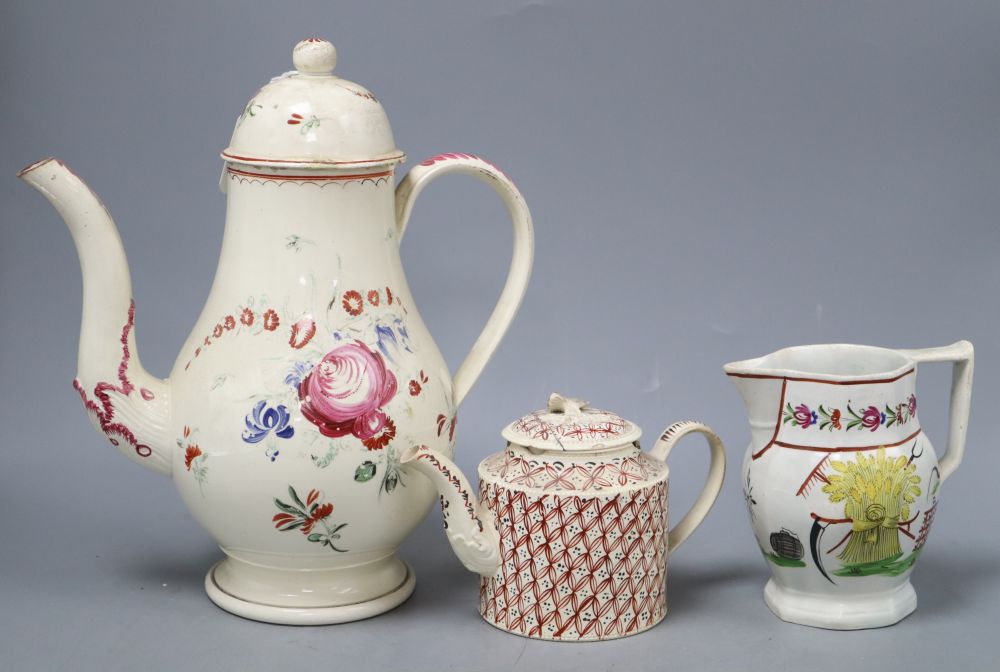 A late 18th century Leeds type creamware coffee pot and cover, an enamelled teapot and cover and a pearlware harvest jug, tallest 28c